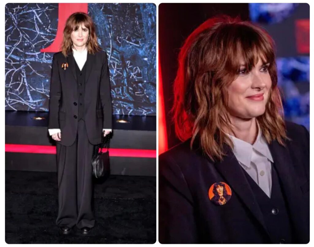 Winona Ryder wears a Kate Bush badge
 